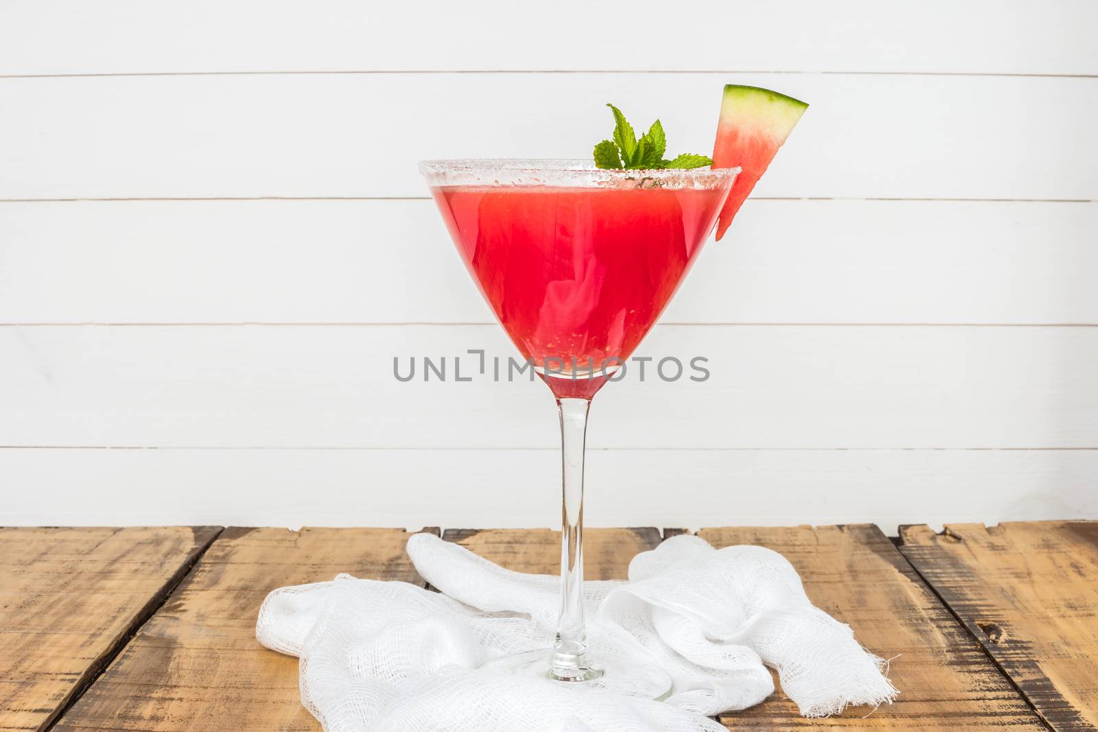 Watermelon juice with mint leaves on wooden vintage background