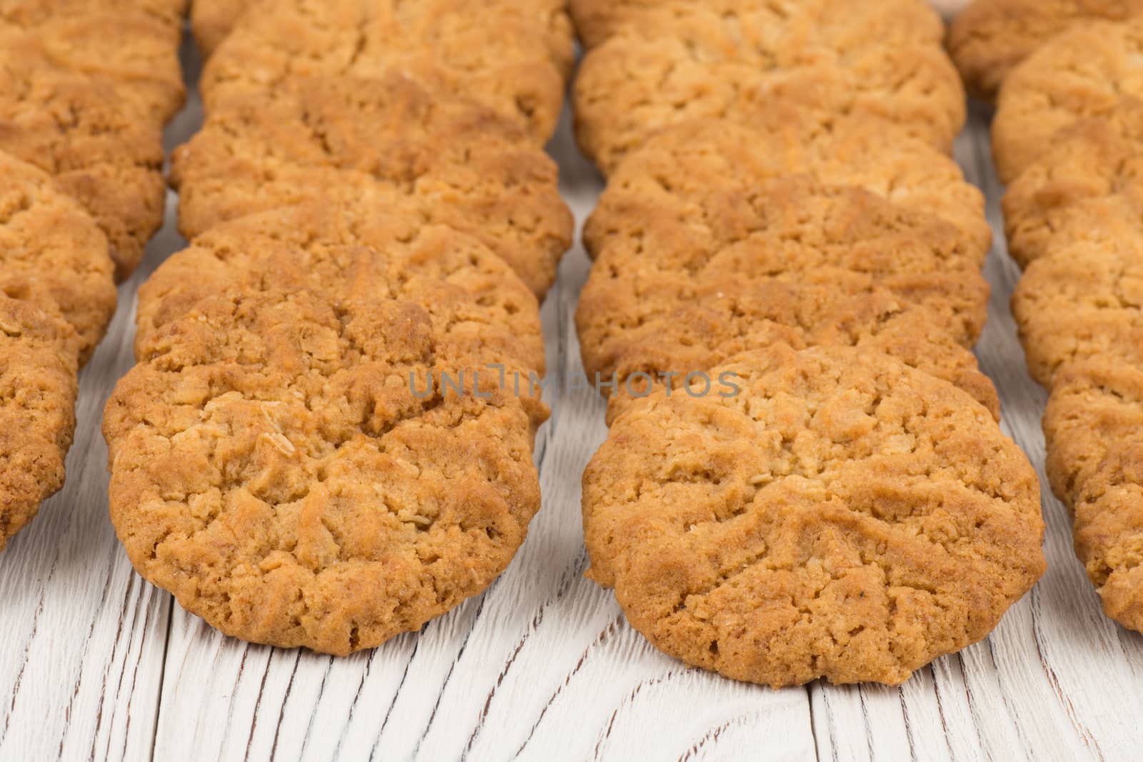 Cookie on old white wooden table. Selective focus.