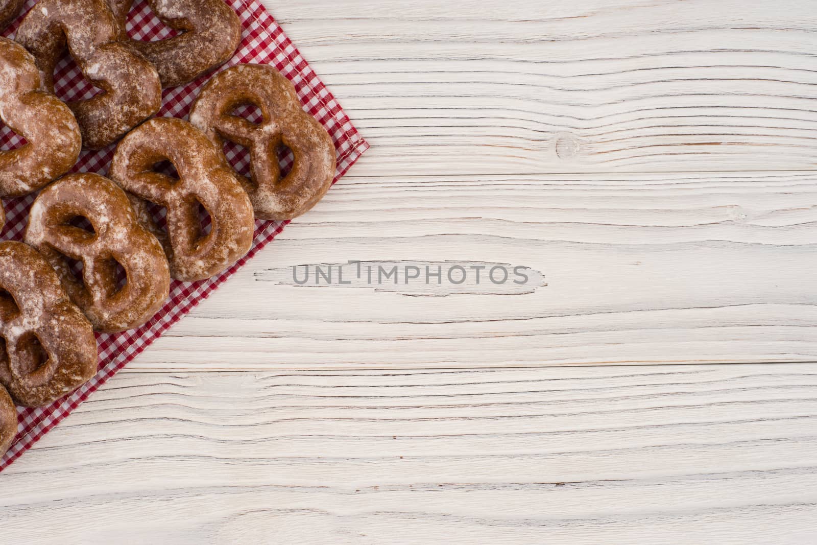 Gingerbread heart cookies on a wooden white background.  by DGolbay