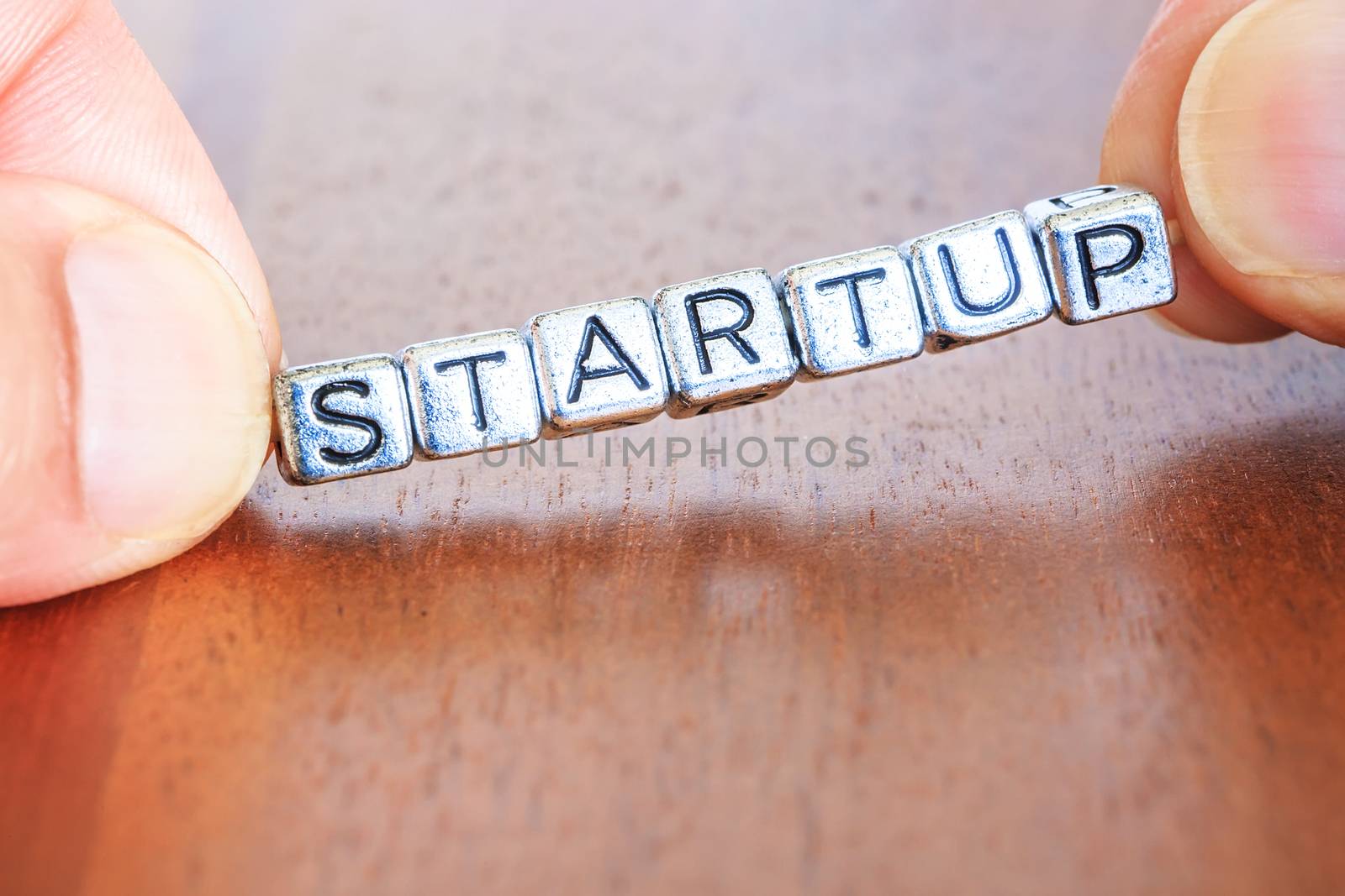 Start up business finance concept with metal letters by pixinoo