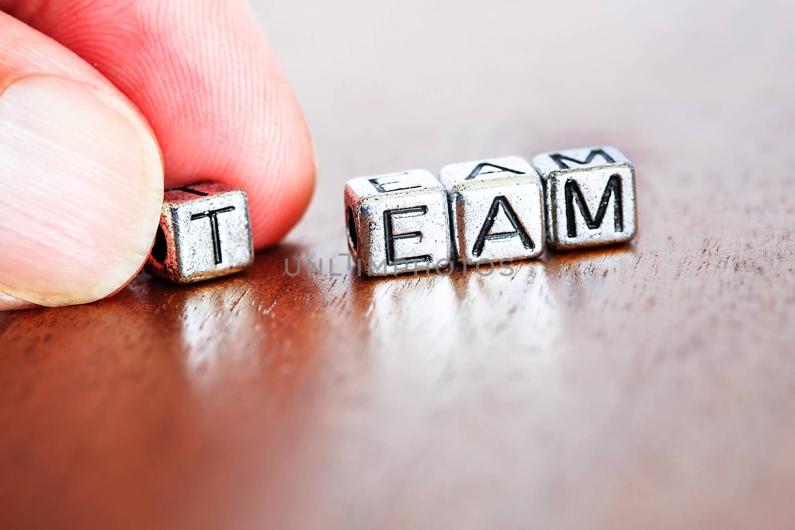 team concept business marketing letters placed on a desk in precious wood