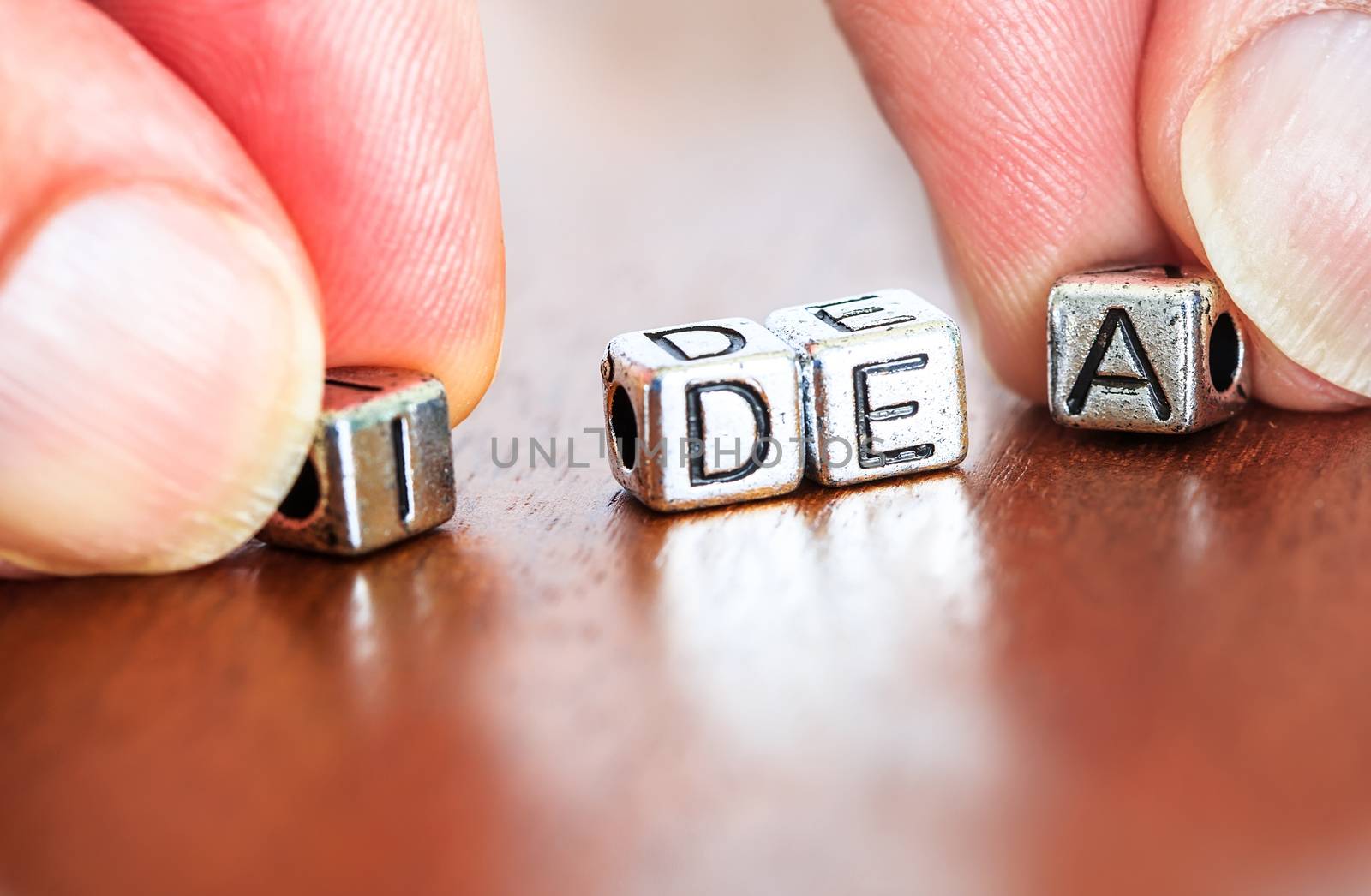 idea concept business marketing letters placed on a desk in precious wood