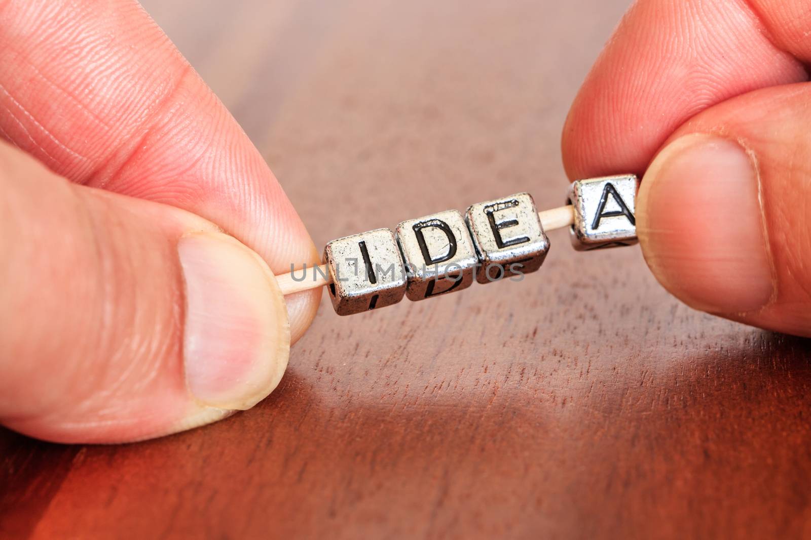 idea concept business marketing letters placed on a desk in precious wood
