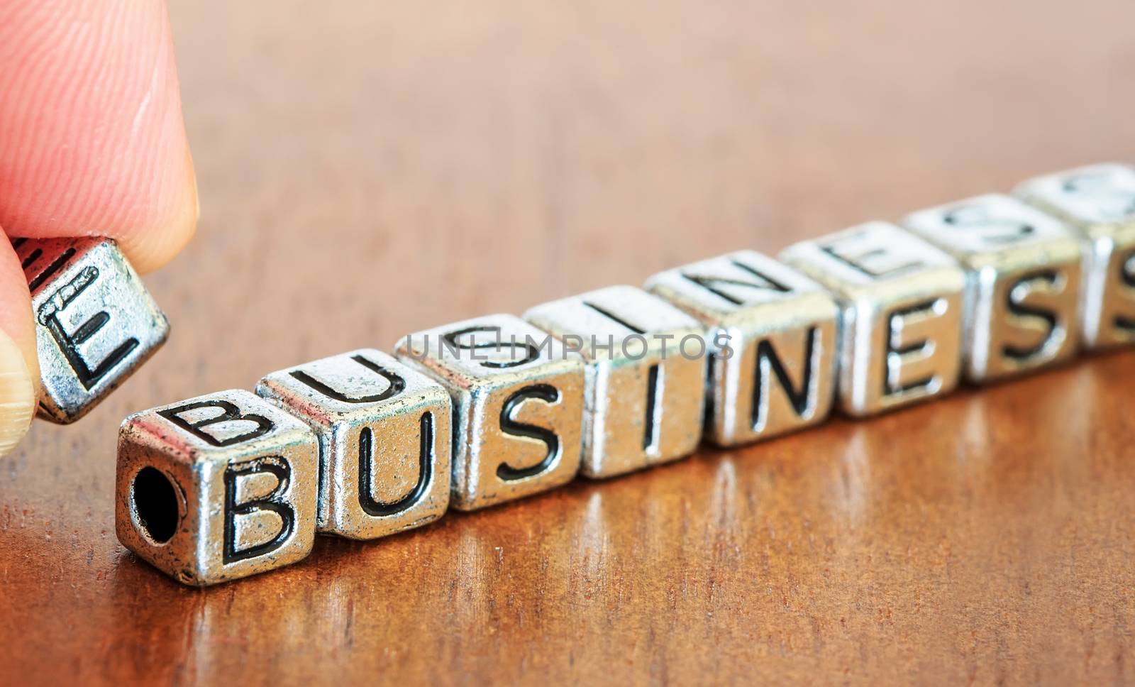 e-business letters placed on a desk in precious wood