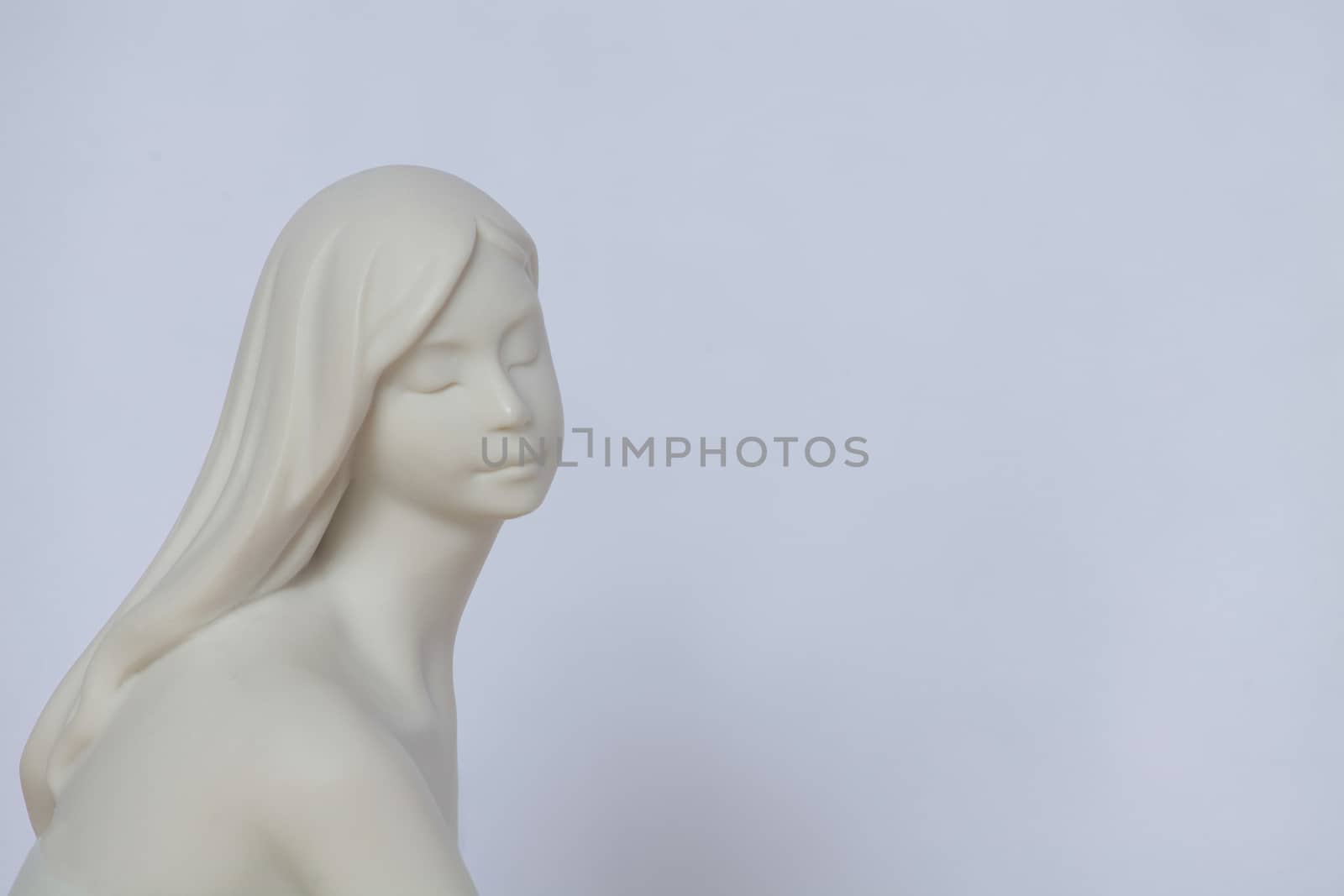 young girl with closed eyes Sculpture isolated on white