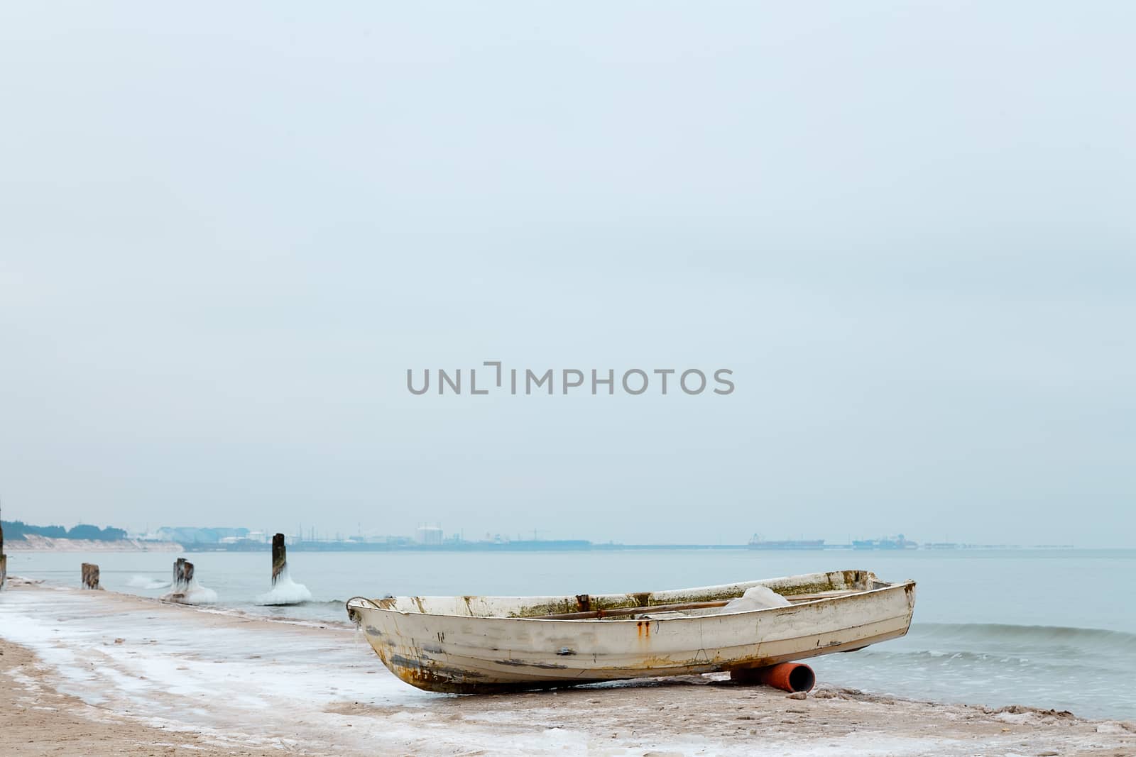 Boat on the shore of the Baltic Sea in winter