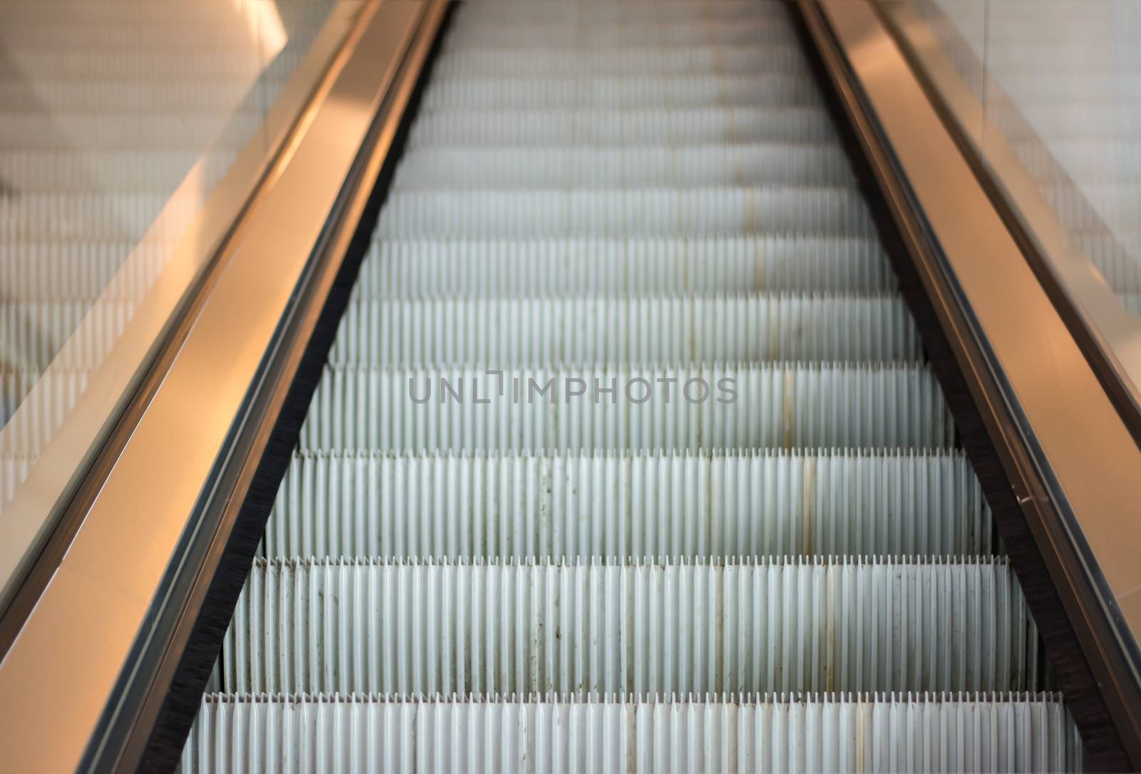 Modern escalator in shopping mall  by ahimaone