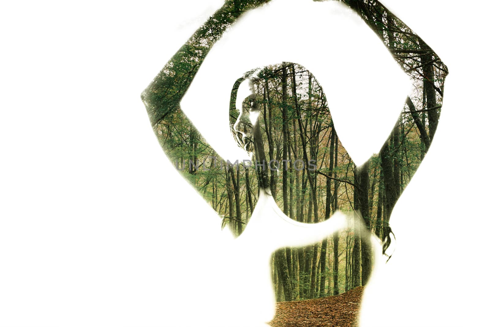 Portrait of a young woman with the effect of double exposure, nature style