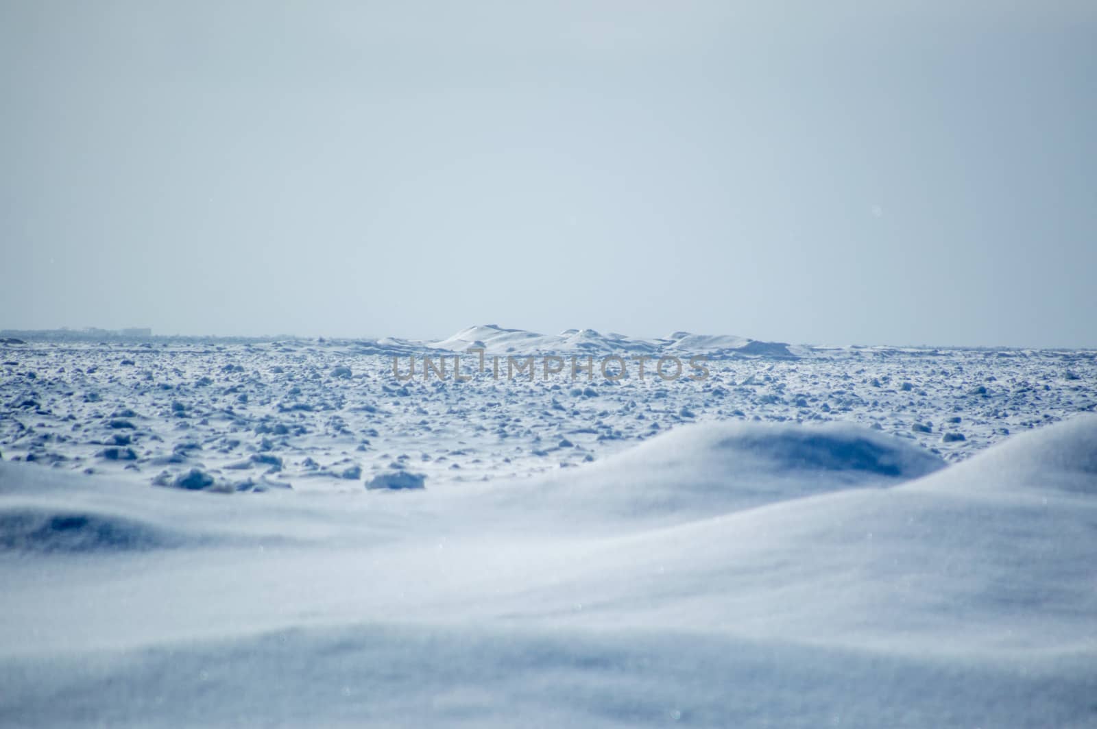 Wintry Lake huron icebergs and snow dunes landscape.