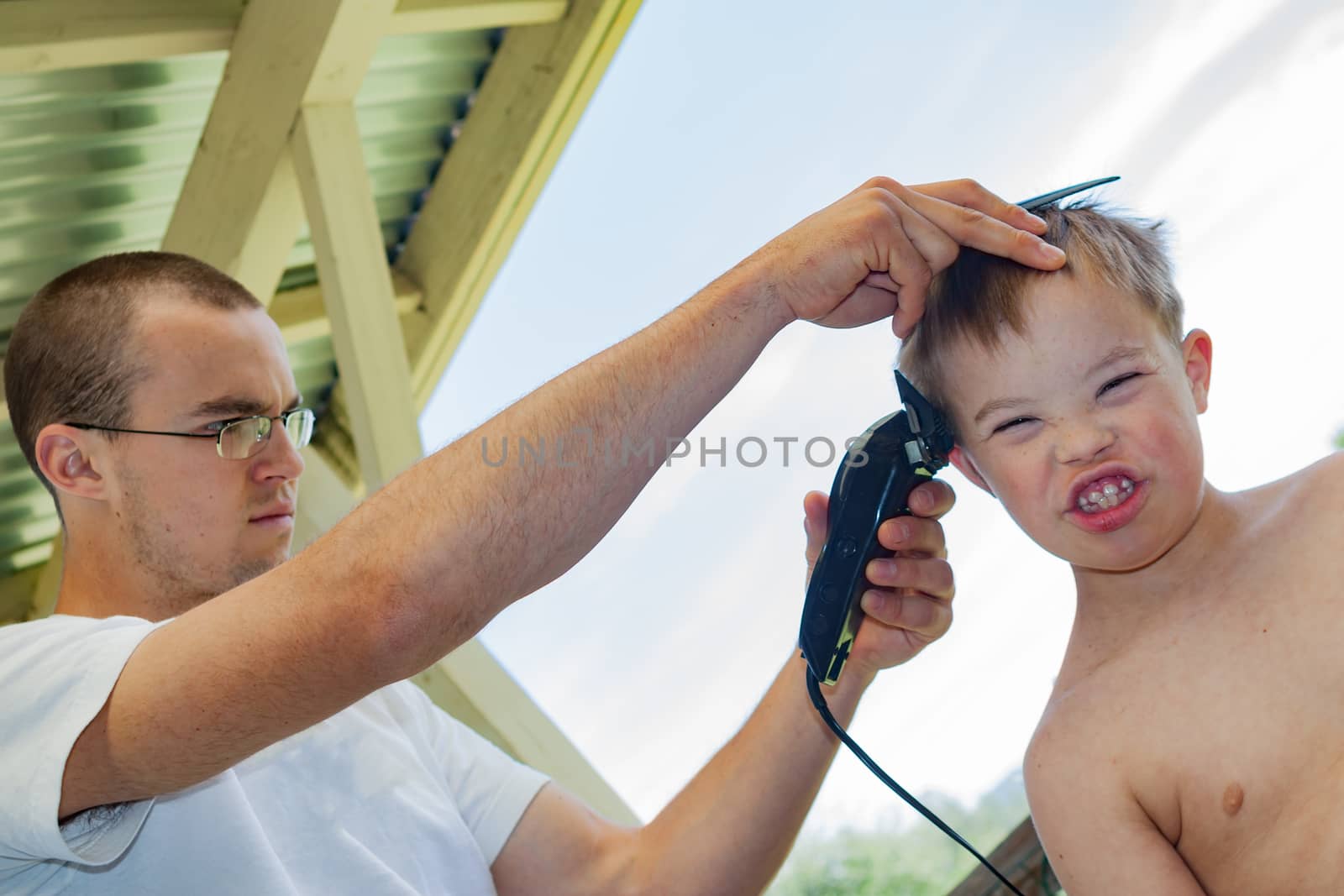 Cute Little Boy With Downs Syndrome Geting His Haircut