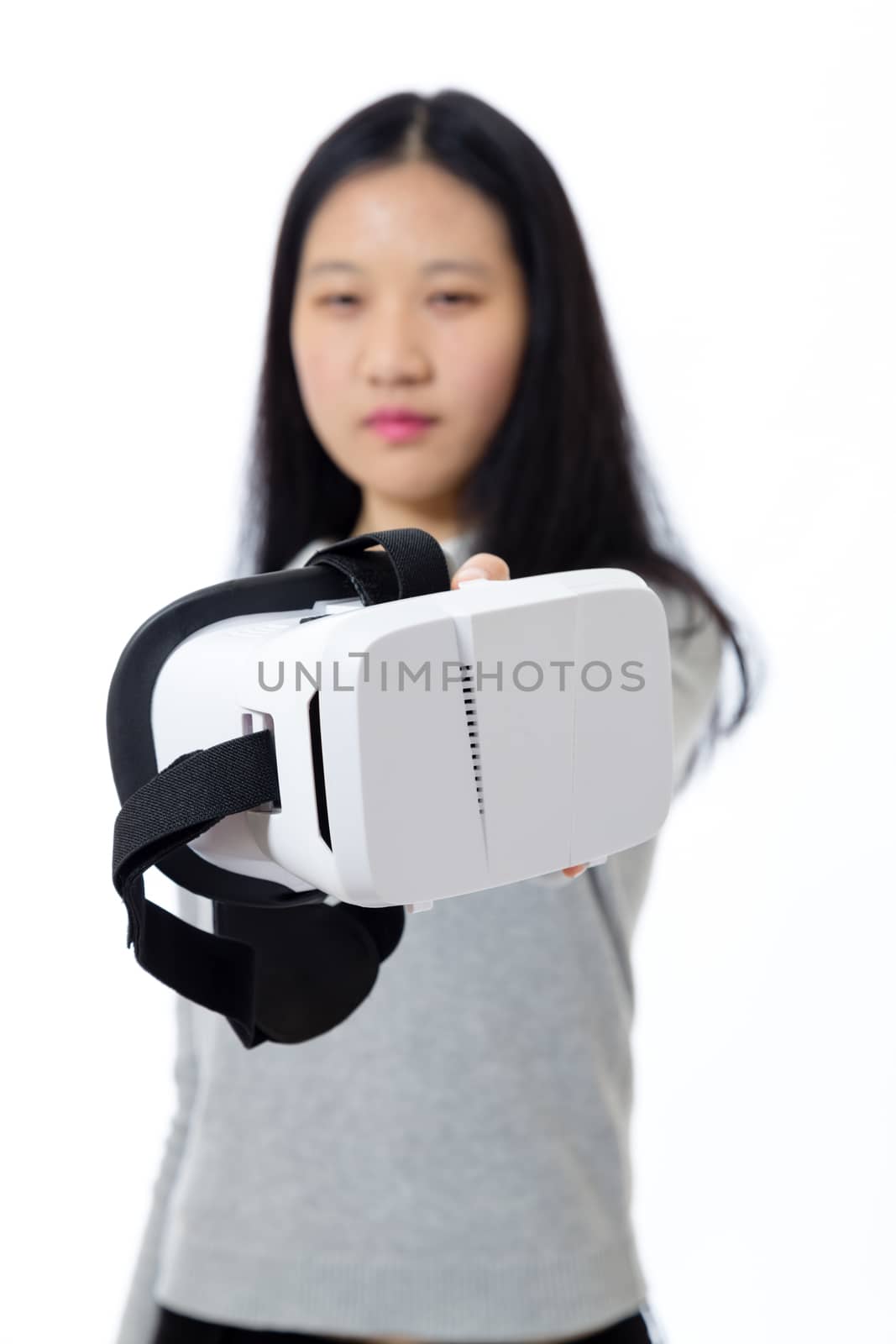 Defocused teenage girl passing 3D goggles