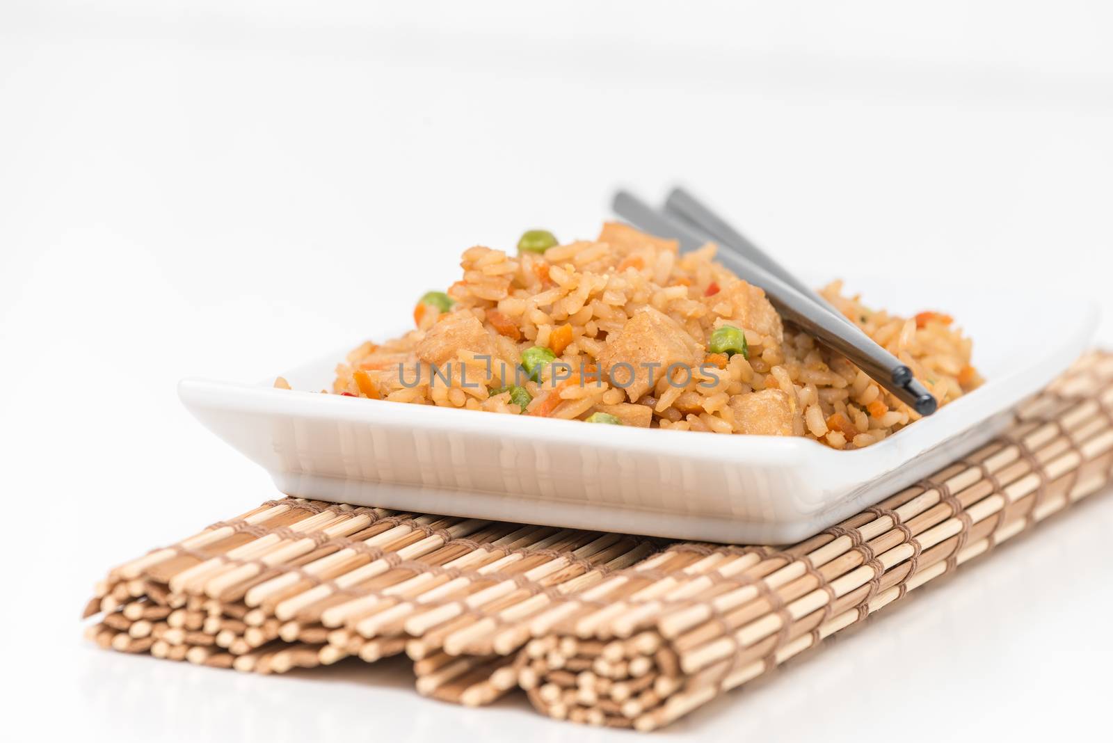 Plate of chicken fried rice photographed closeup.