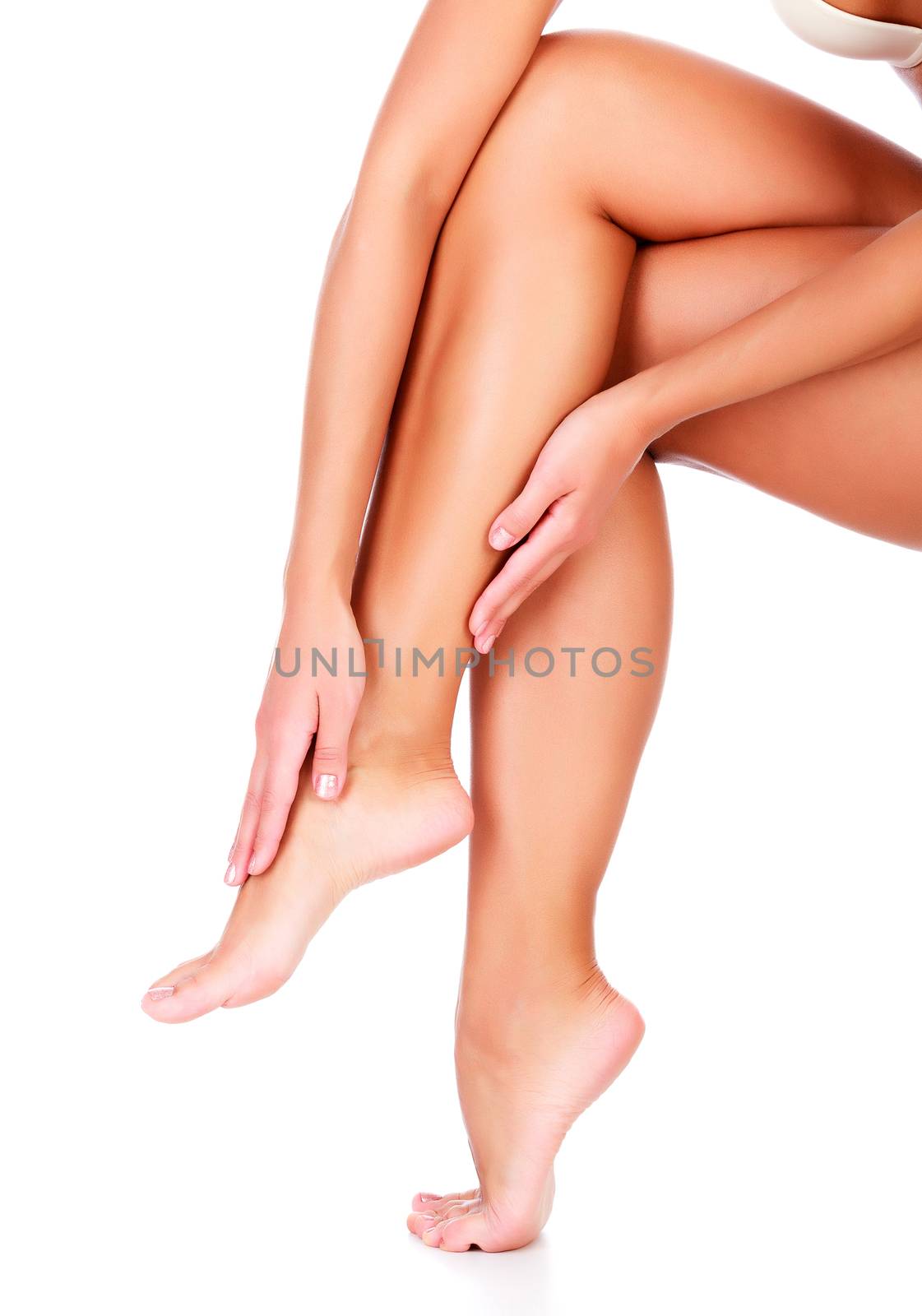 Female legs and hands, white background, isolated by Nobilior