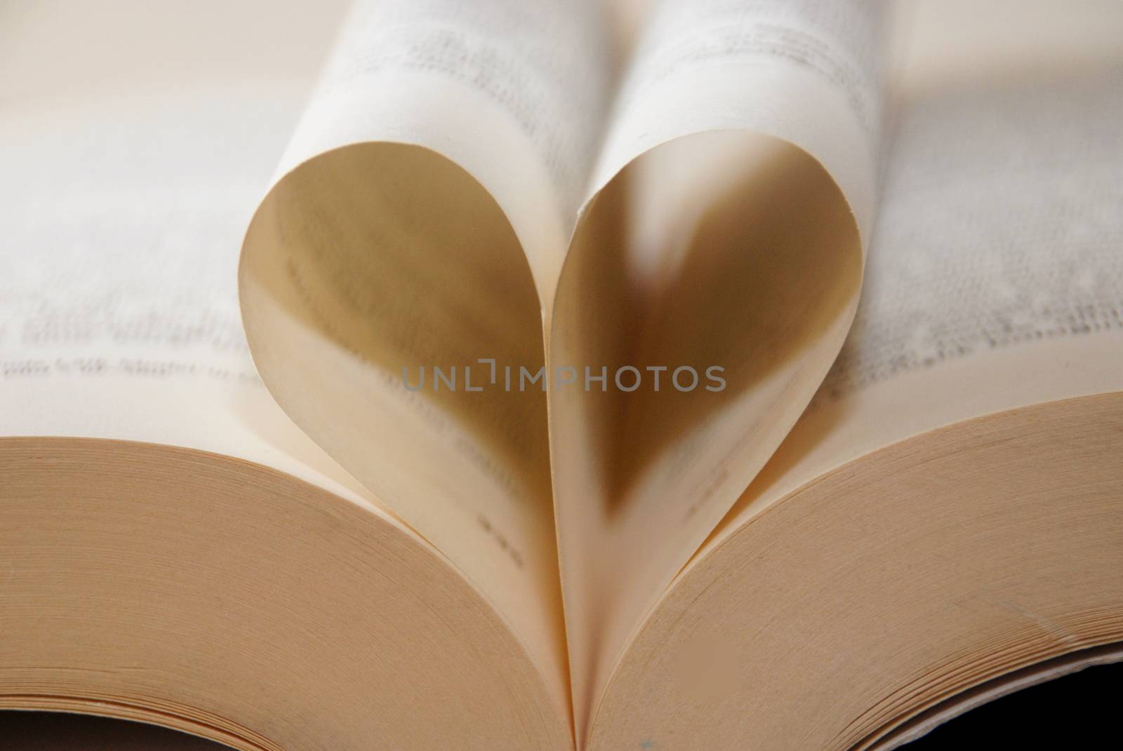 Book pages in the shape of a heart. I like to read, reading.