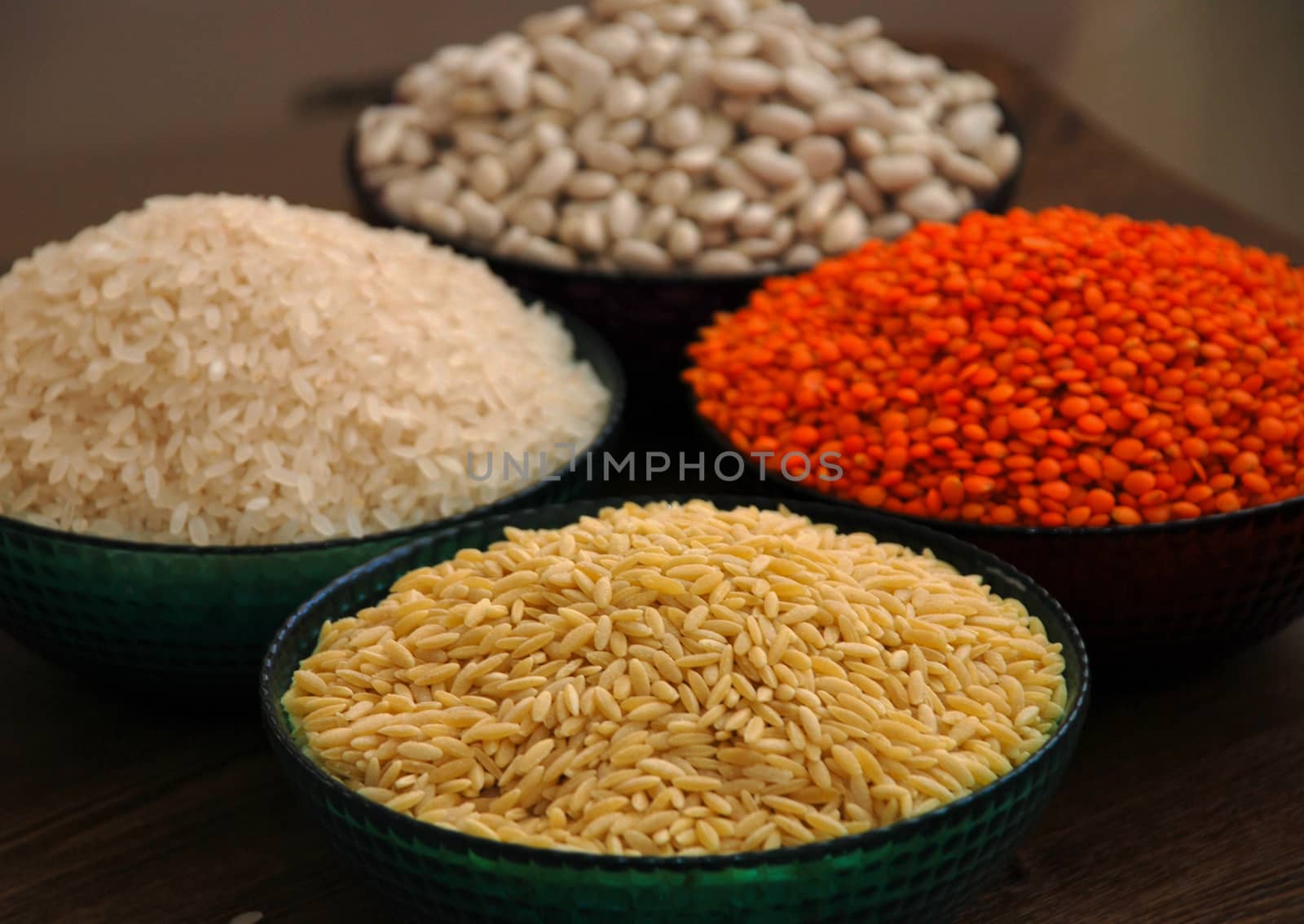 in a glass bowl of rice, red lentils, haricot beans and barley noodles