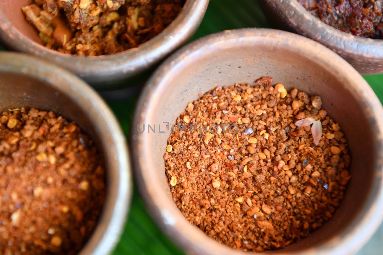 Roasted chili in bowl baked clay. by chatchai