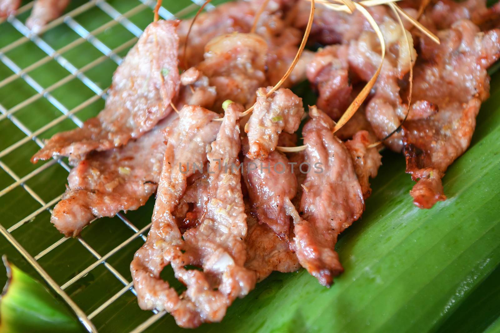 Grilled pork with herbs, traditional cook, Thai food.