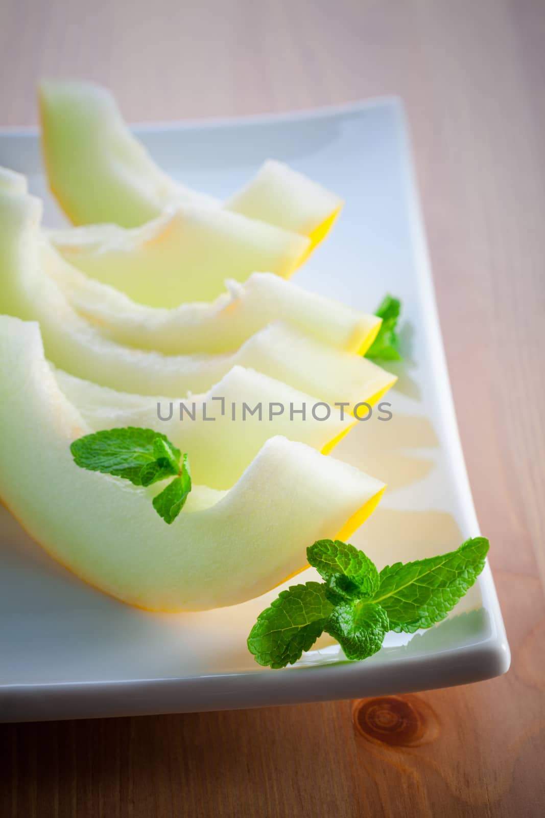 Honeydew melon slices by supercat67