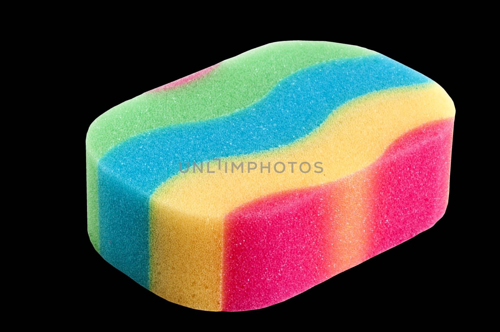  a  colored sponge  on a  black background