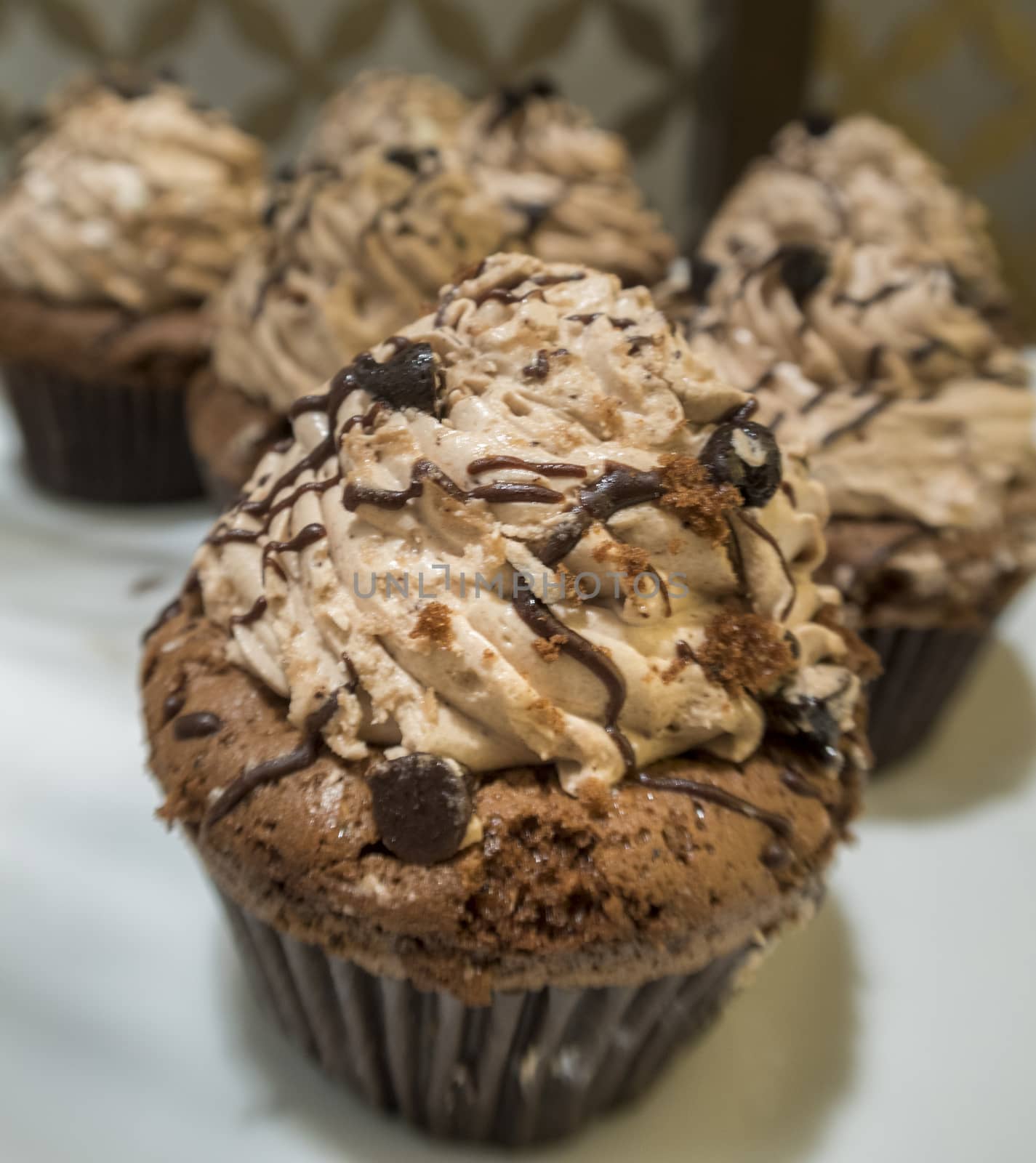 Homemade Chocolate Cupcake with chocolate frosting, selective focus