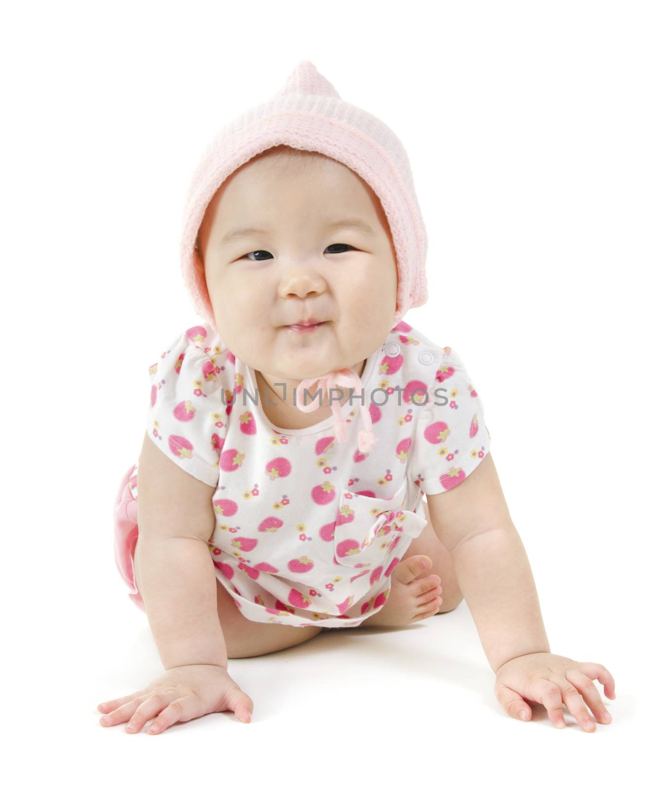 Portrait of full length happy Asian baby girl in pink clothes crawling on floor, isolated on white background.