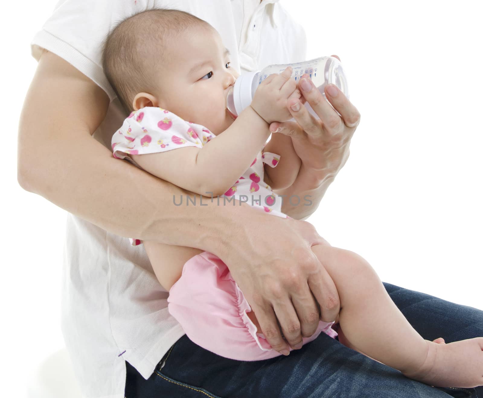Asian new father feeding baby girl drinking milk bottle, isolated on white background.