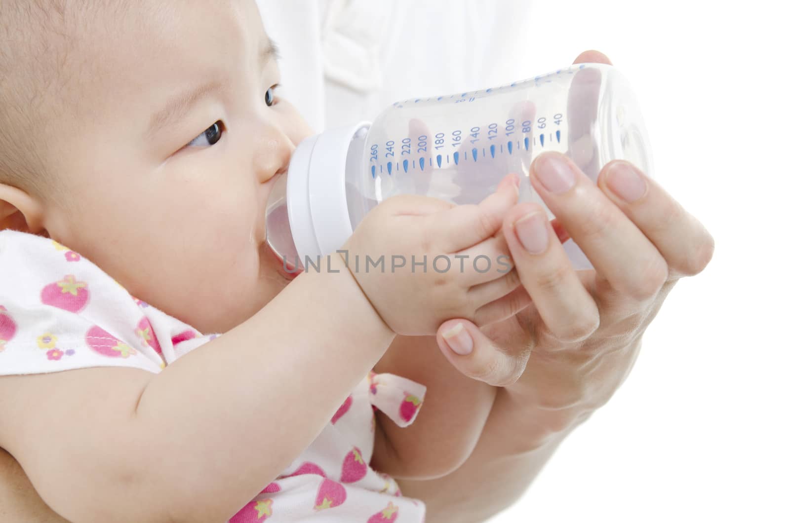 Asian new father feeding baby girl drinking milk bottle, close up on face, isolated white background.