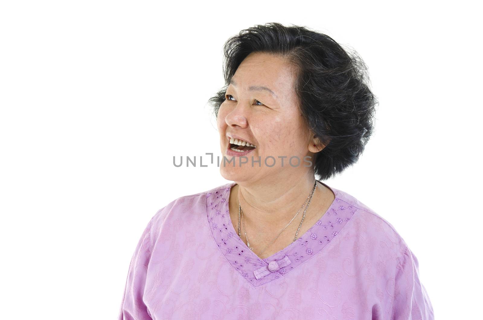 Portrait of Asian senior adult woman smiling and looking at side, isolated on white background.