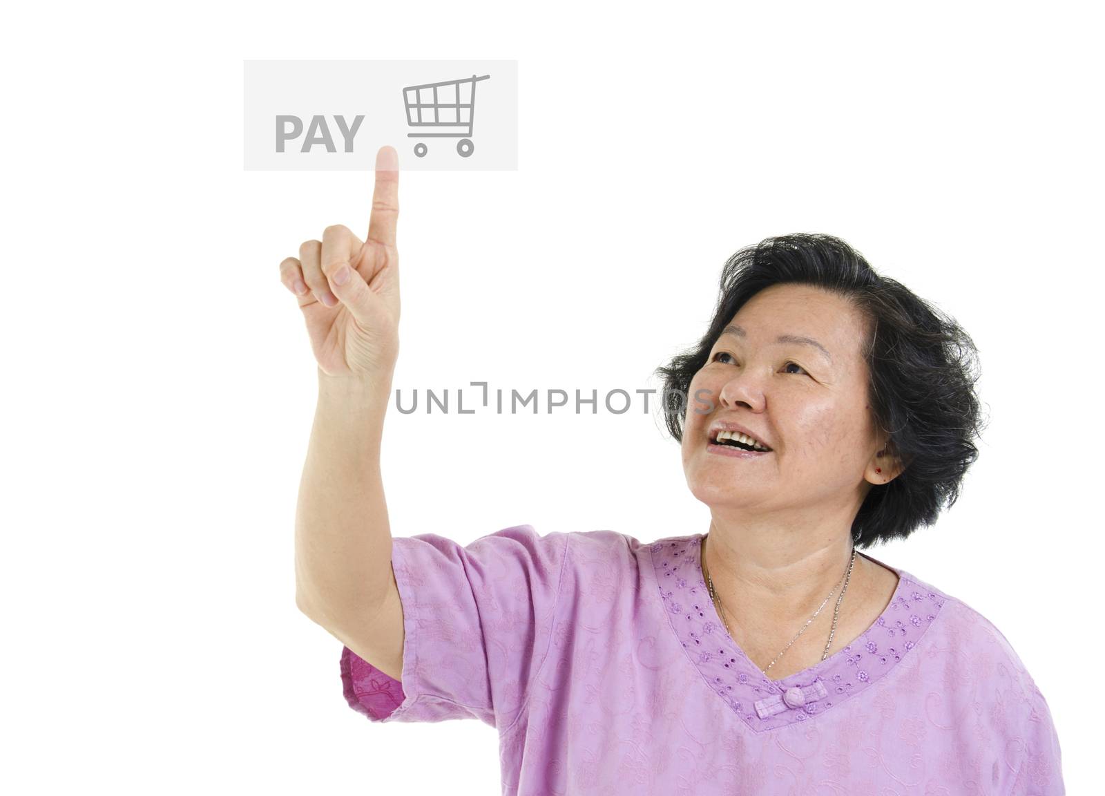 Portrait of Asian senior adult woman online shopping and finger pushing at check out pay button, isolated on white background.