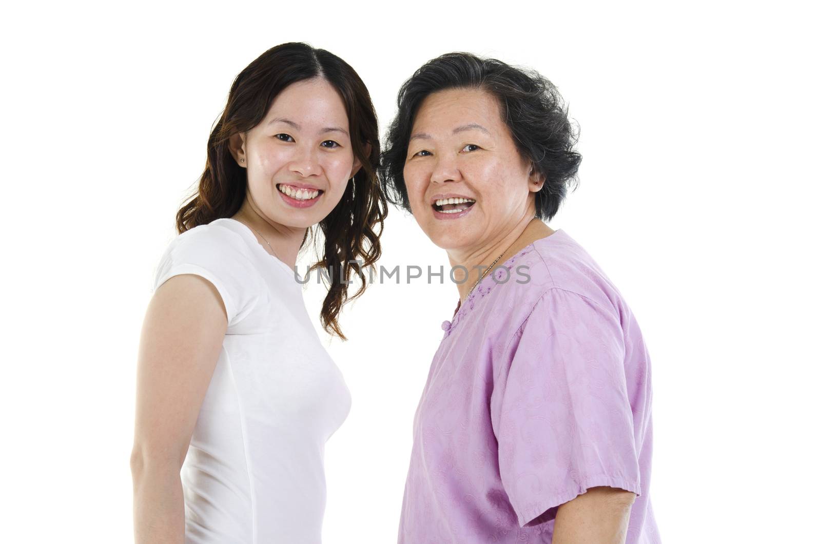 Portrait of Asian adult daughter and senior mother smiling, isolated on white background.