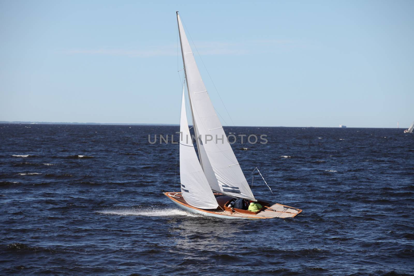 classic yacht with white sails in the sea in motion