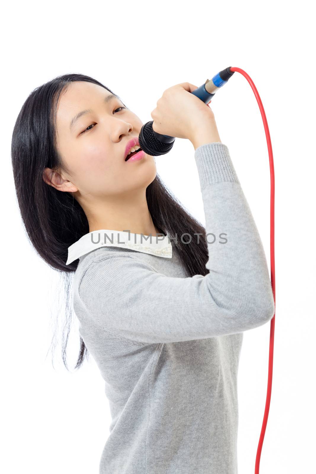 Chinese teenage girl holding microphone