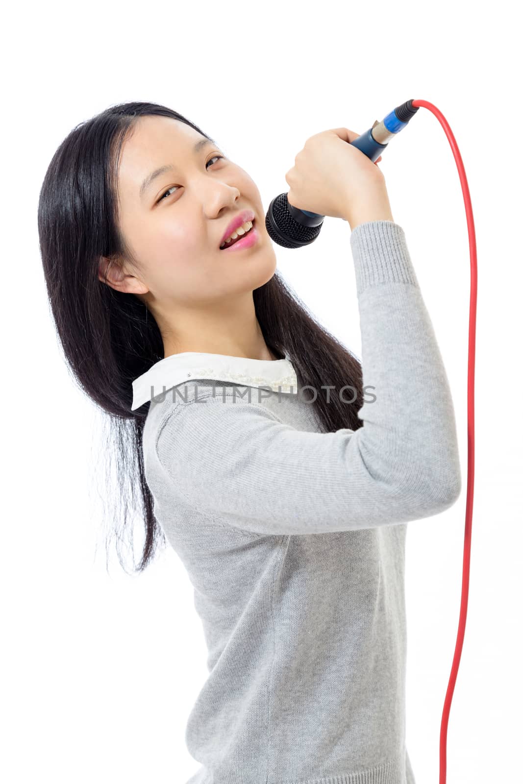 Chinese teenage girl holding microphone