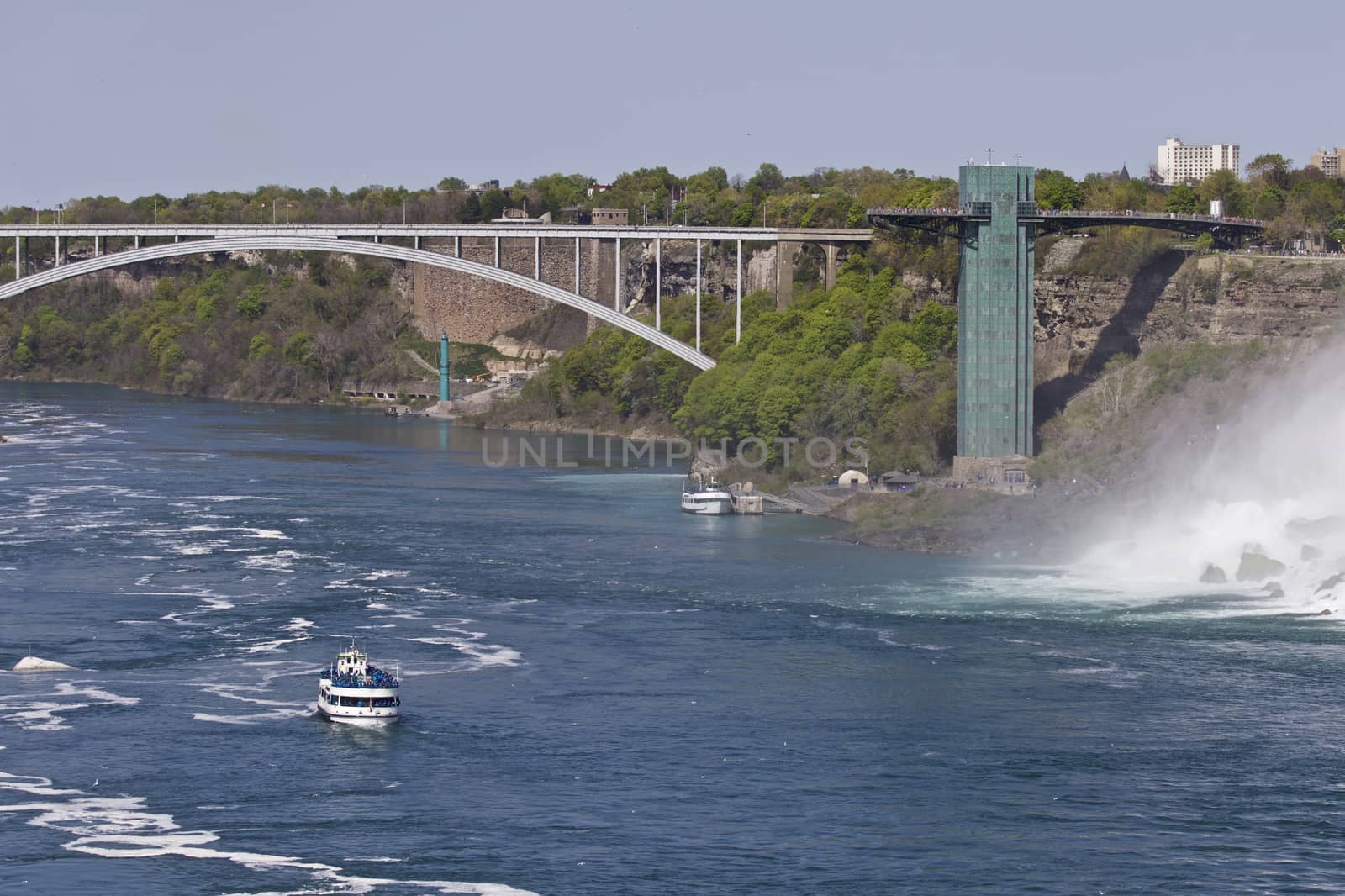 Beautiful photo of the amazing Niagara waterfall, a bridge and a ship at the US side by teo