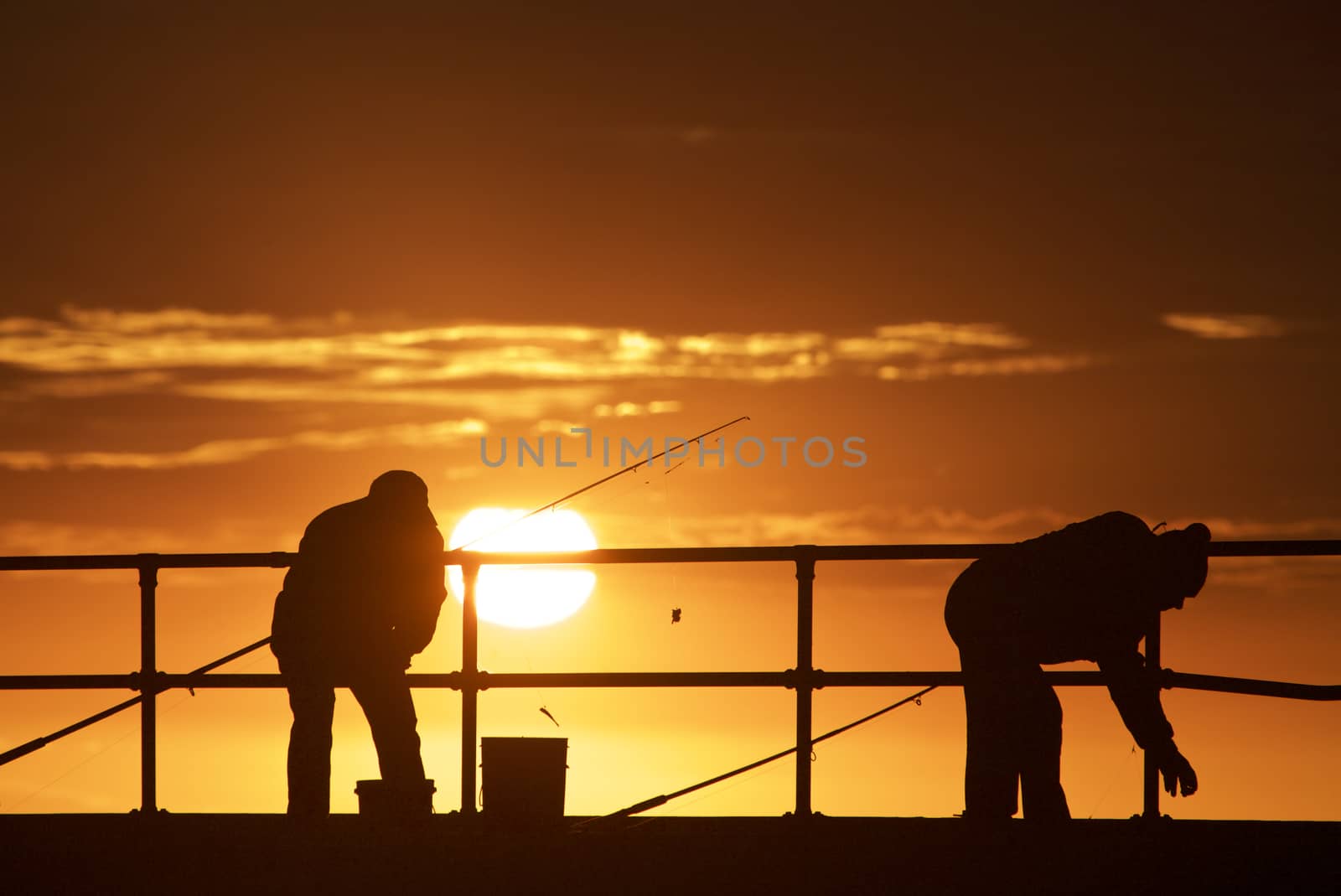 Fishing men at Mordialloc Beach, Port Phillip Bay, Melbourne, Australia