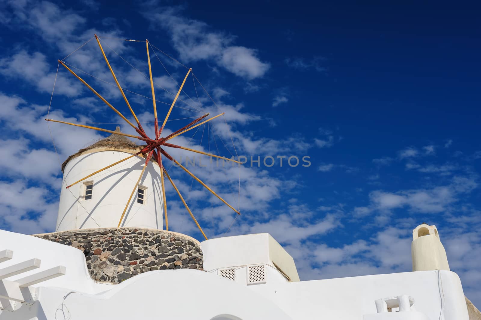 View of Oia windmill at the Island Santorini, Greece. Lot of copyspace.