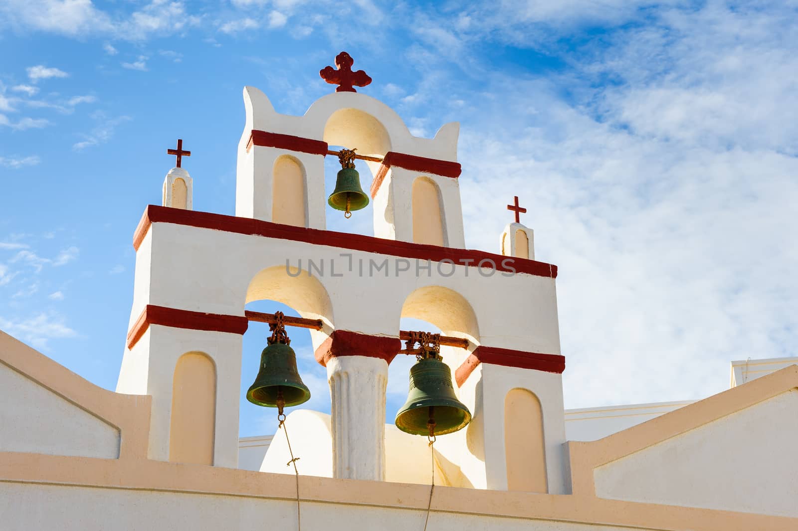 White orthodox church bell tower. Oia, Santorini Greece. Copyspace