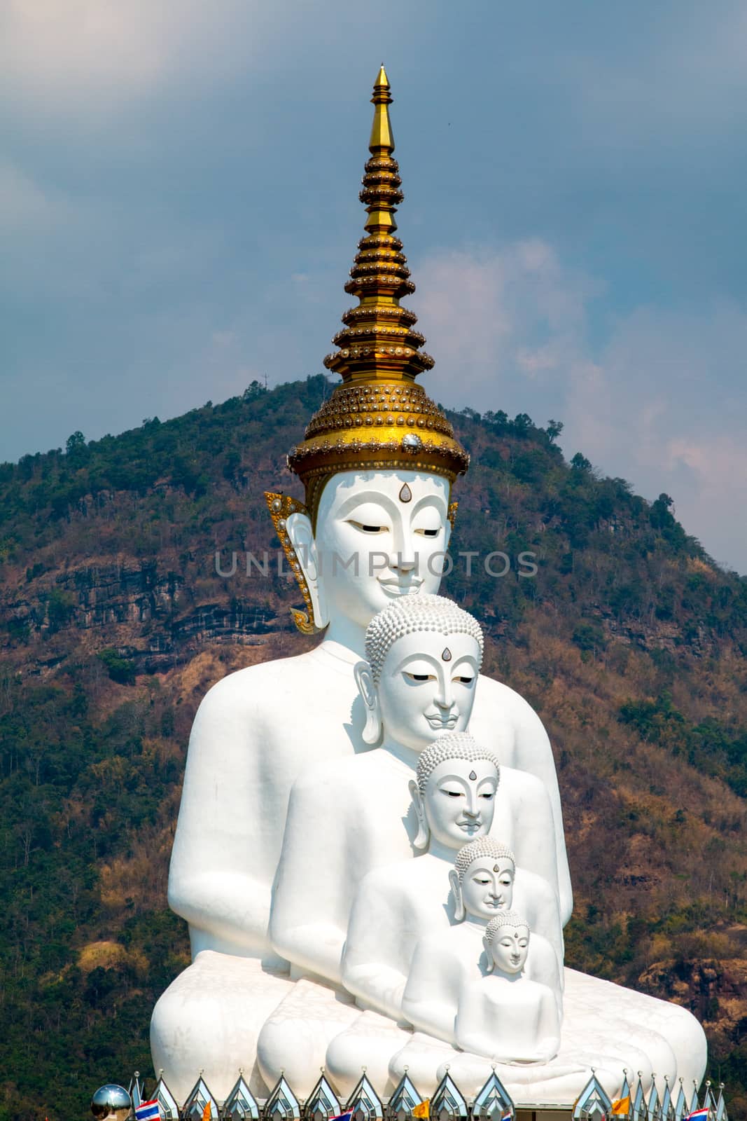 Phetchabun, Thailand - February 23.2017: Buddha statues and colored foot path colorful glass stacked in Wat Pha Kaew, Khao Kho, Phetchabun on February 23.2017 at Thailand.There. A famous Buddhist temple.