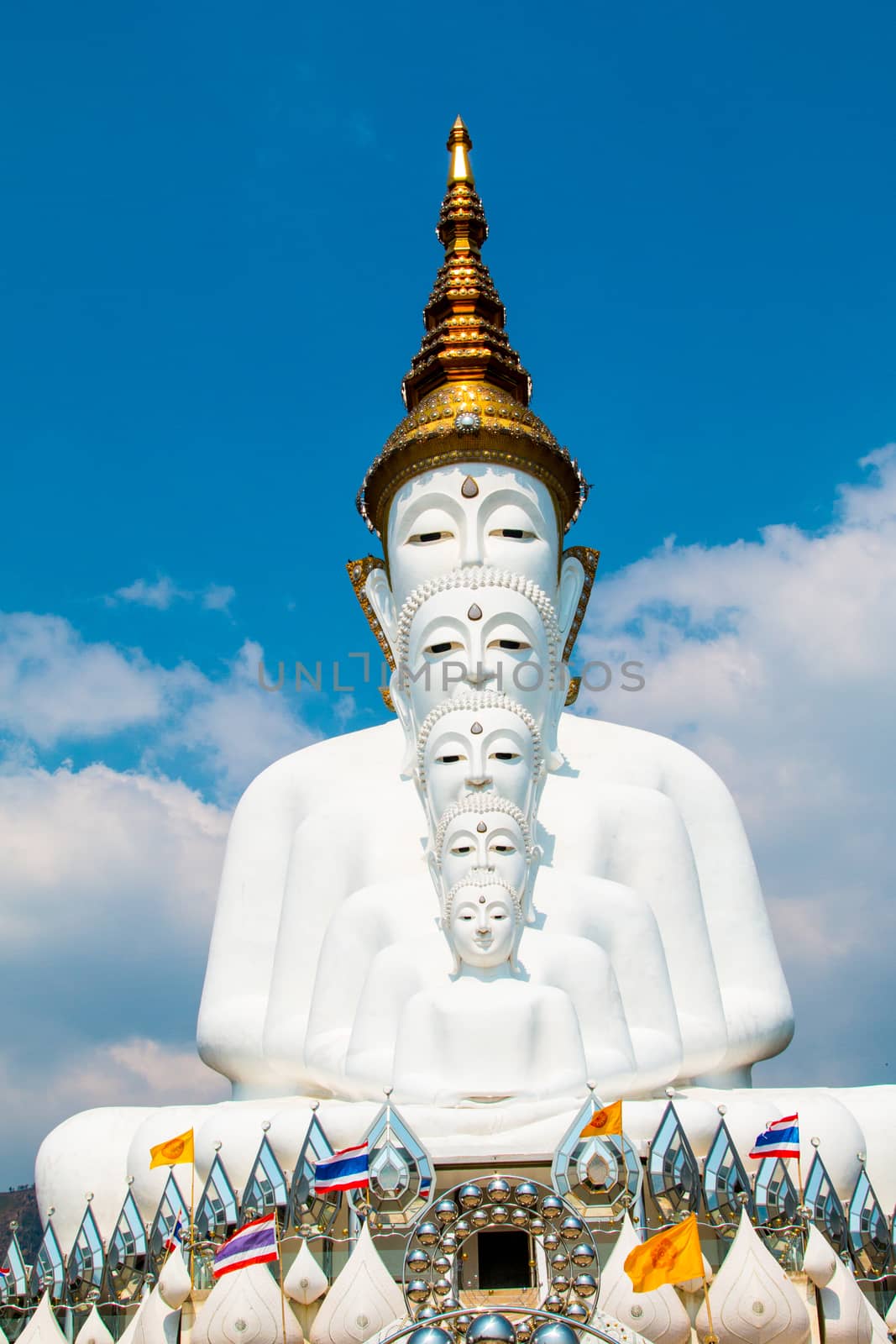 Phetchabun, Thailand - February 23.2017: Buddha statues and colored foot path colorful glass stacked in Wat Pha Kaew, Khao Kho, Phetchabun on February 23.2017 at Thailand.There. A famous Buddhist temple.