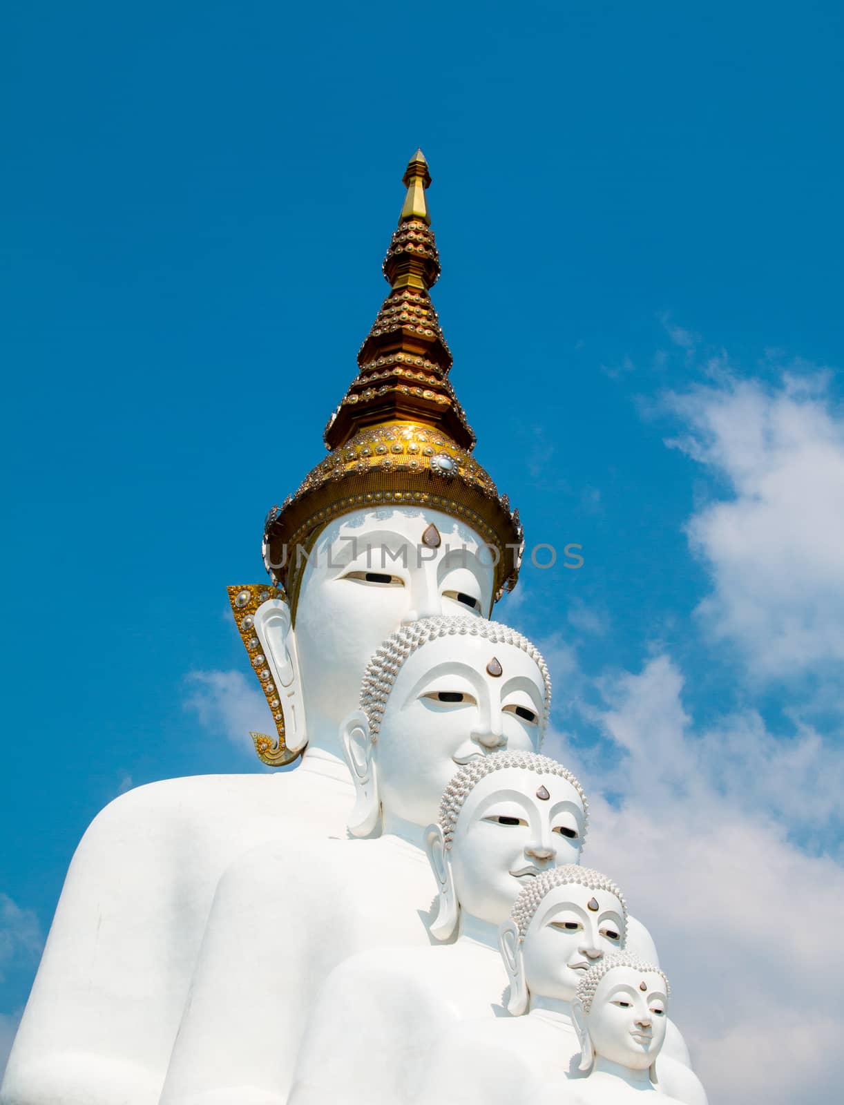 Phetchabun, Thailand - February 23.2017: Buddha statues and colored foot path colorful glass stacked in Wat Pha Kaew, Khao Kho, Phetchabun on February 23.2017 at Thailand.There. A famous Buddhist temple.