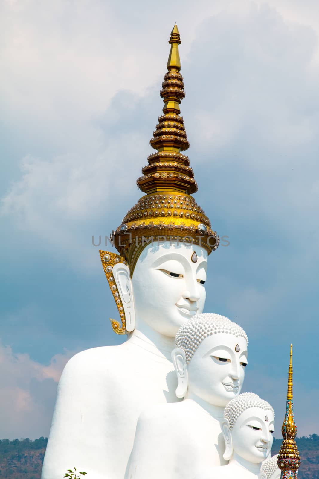 Phetchabun, Thailand - February 23.2017: Buddha statues and colored foot path colorful glass stacked in Wat Pha Kaew, Khao Kho, Phetchabun on February 23.2017 at Thailand.There. A famous Buddhist temple.