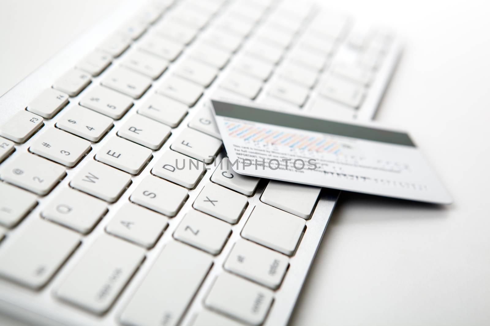 bank card lies on the laptop keyboard close up