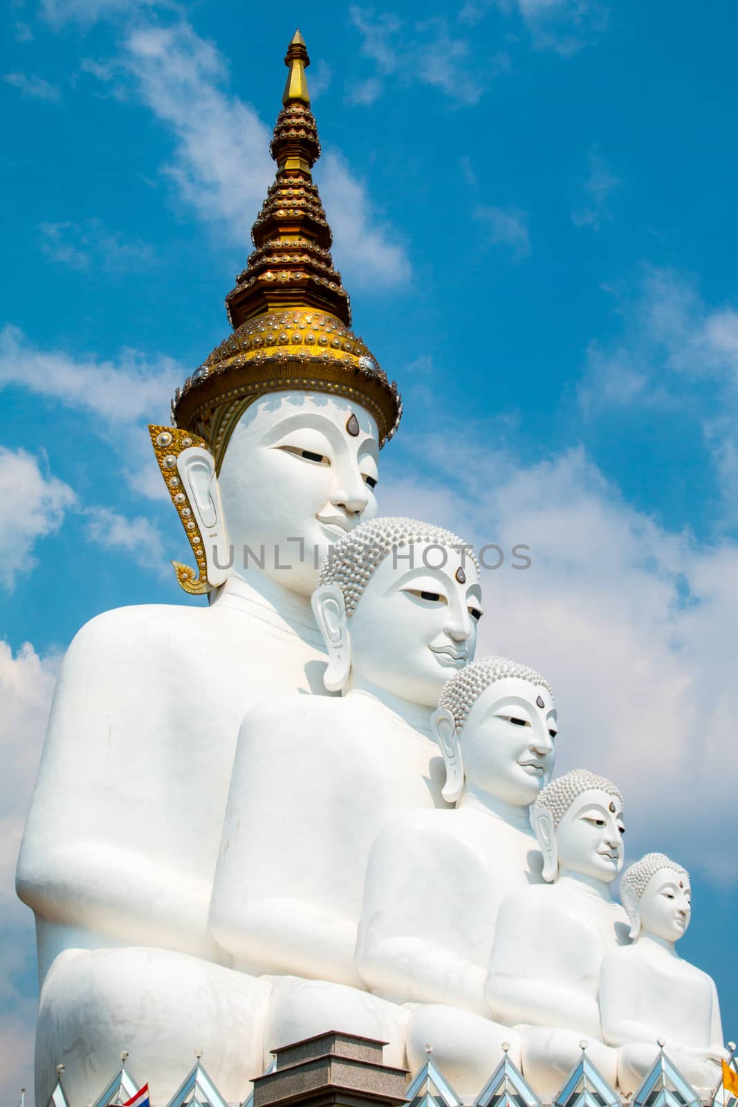 Phetchabun, Thailand - February 23.2017: Buddha statues and colored foot path colorful glass stacked in Wat Pha Kaew, Khao Kho, Phetchabun on February 23.2017 at Thailand.There. A famous Buddhist temple.