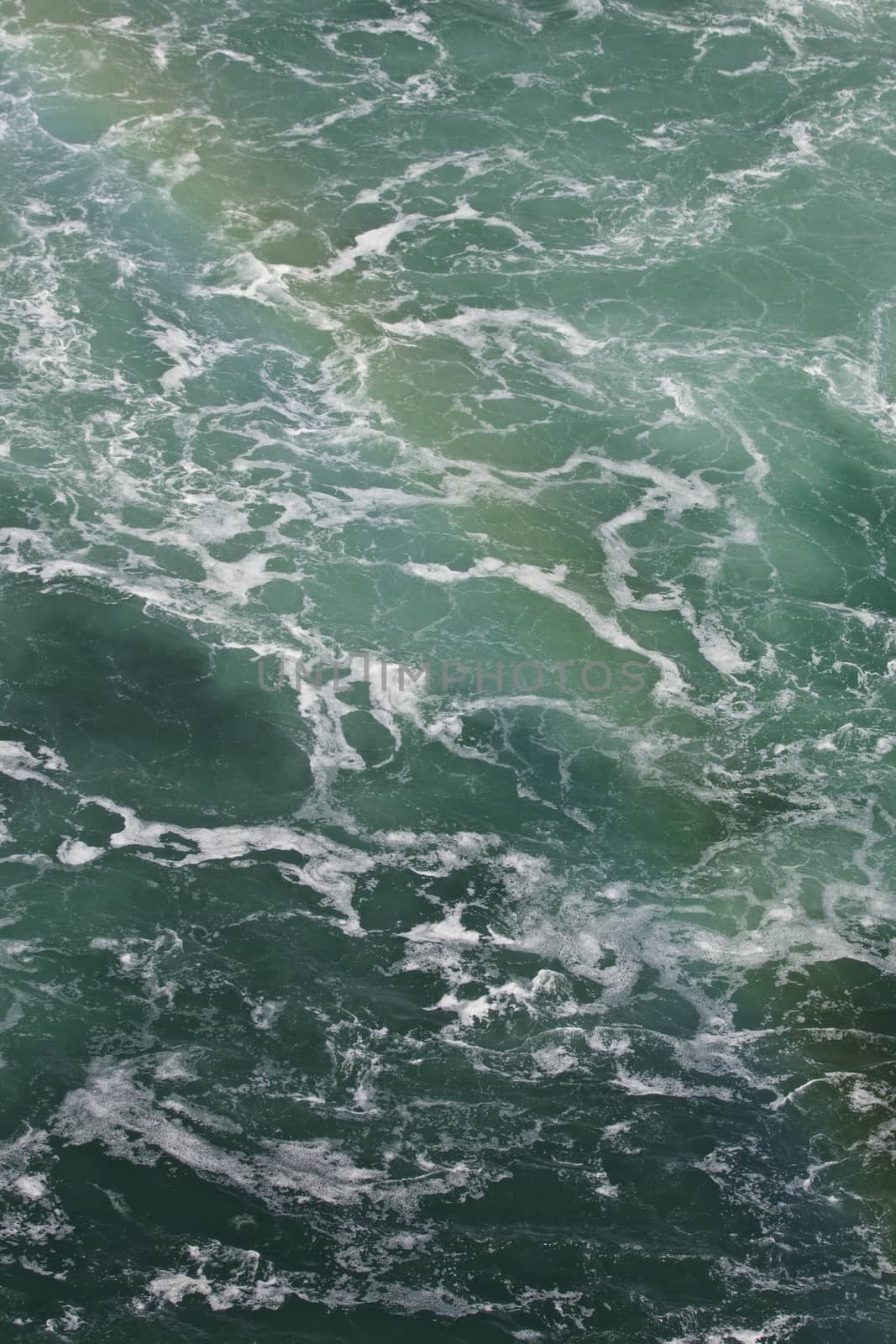 Beautiful photo of the water near amazing Niagara falls with a rainbow