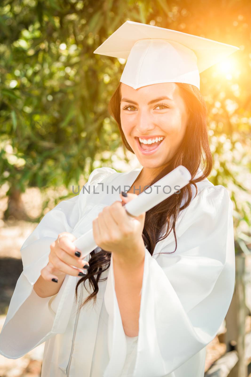 Graduating Mixed Race Girl In Cap and Gown with Diploma by Feverpitched