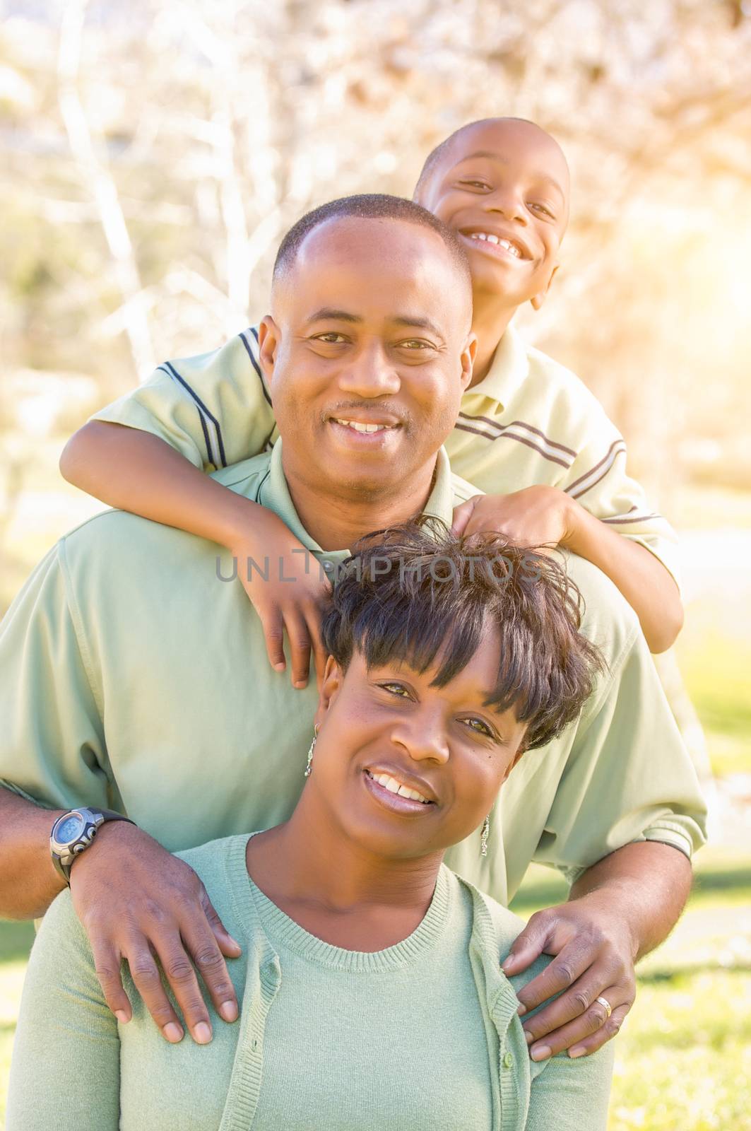 Beautiful Happy African American Family Portrait Outdoors At The Park.