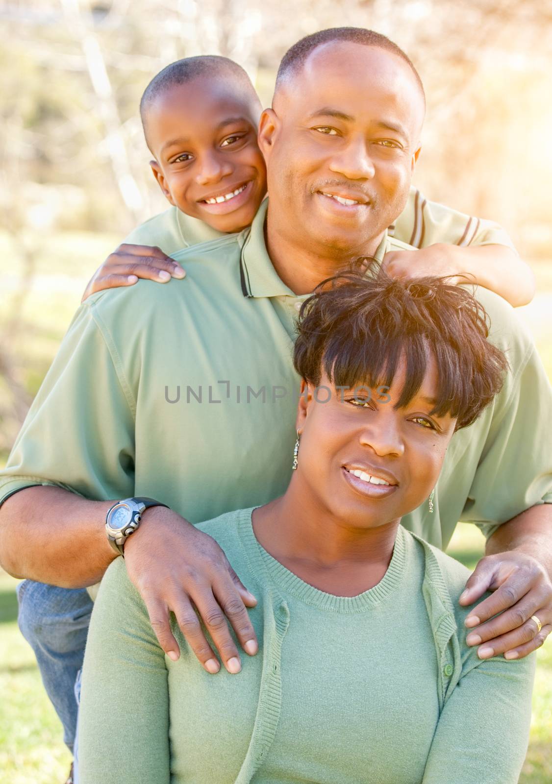 Beautiful Happy African American Family Portrait Outdoors by Feverpitched