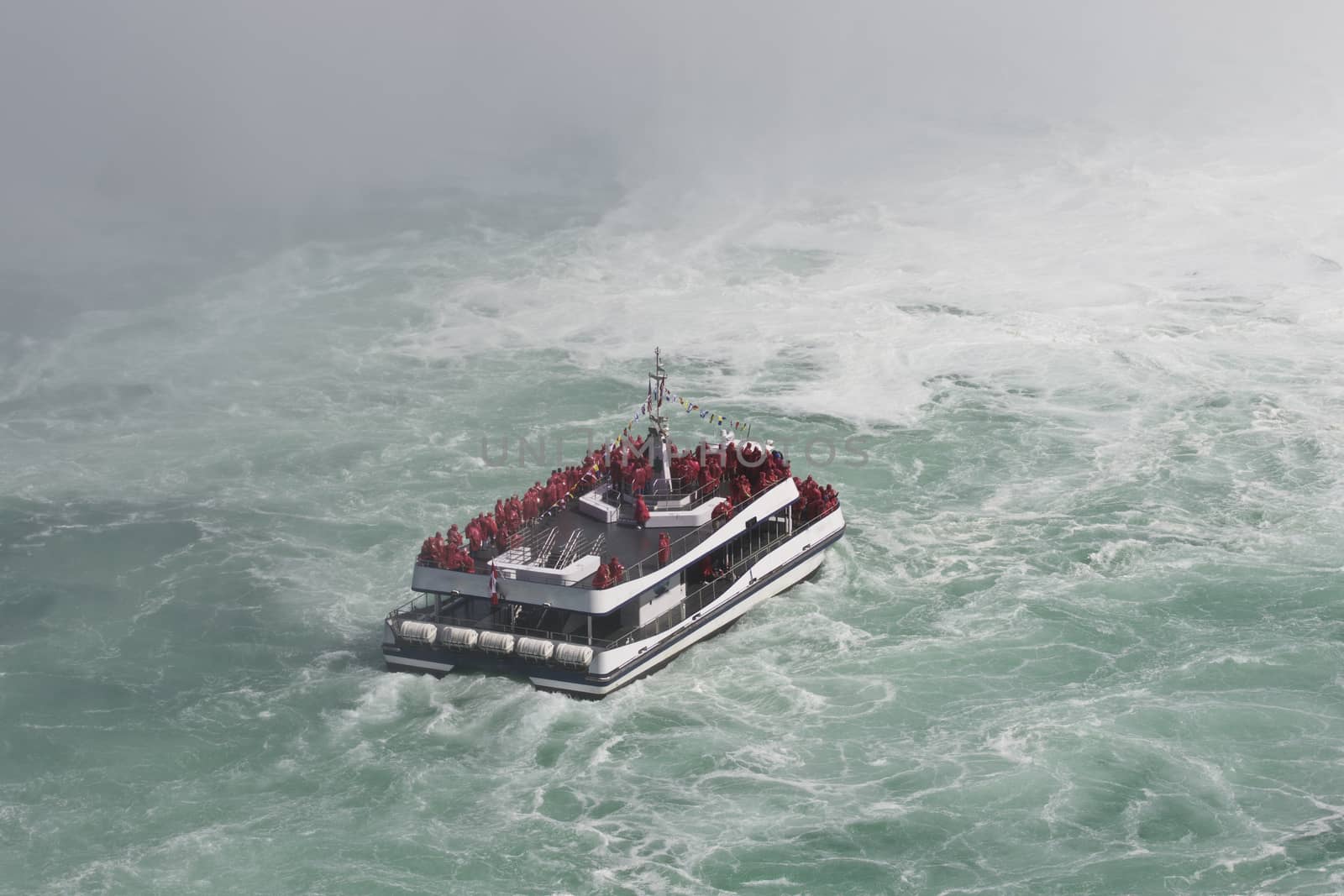 Beautiful photo of a ship in the mist of the amazing Niagara falls by teo