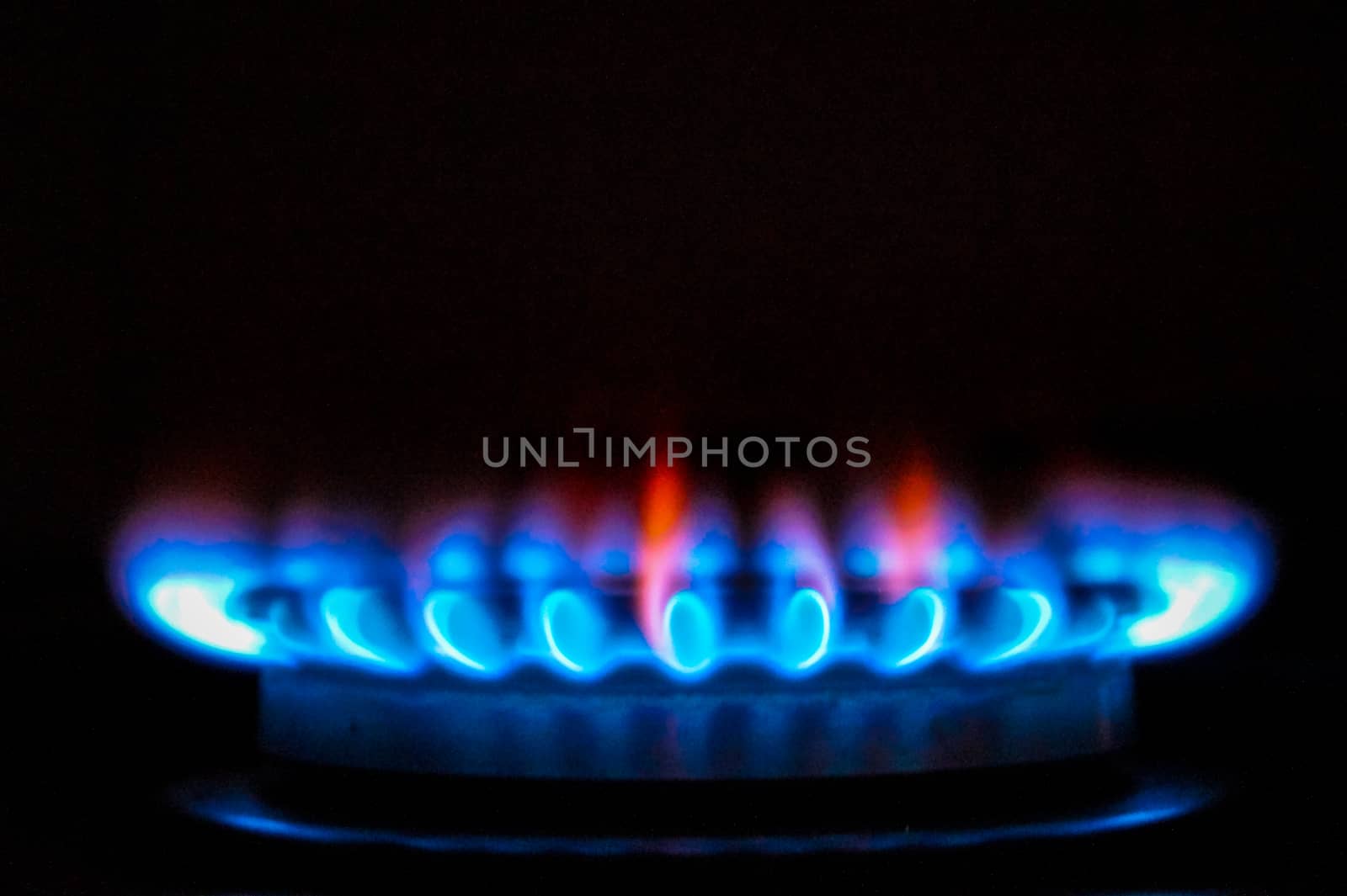 the fire of the gas stove over black background by Oleczka11