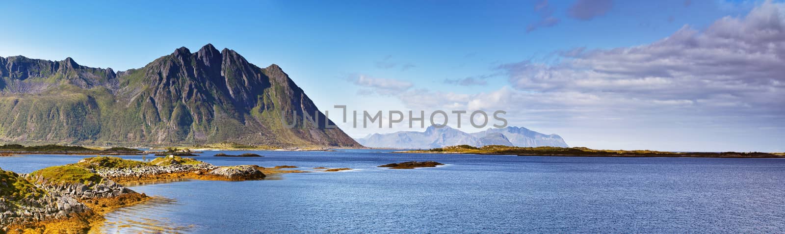 Norway landscape sunny summer panorama, fjord and mountains in the background